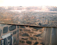 Stripping and cleaning a wooden beam.