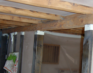 Cleaning wooden beams.