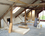 House renovation: Wooden beams during sandblasting.