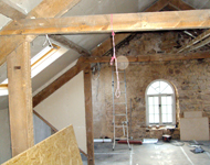 House renovation: Wooden beams during sandblasting.