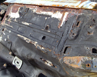 Underneath car body before sandblasting.